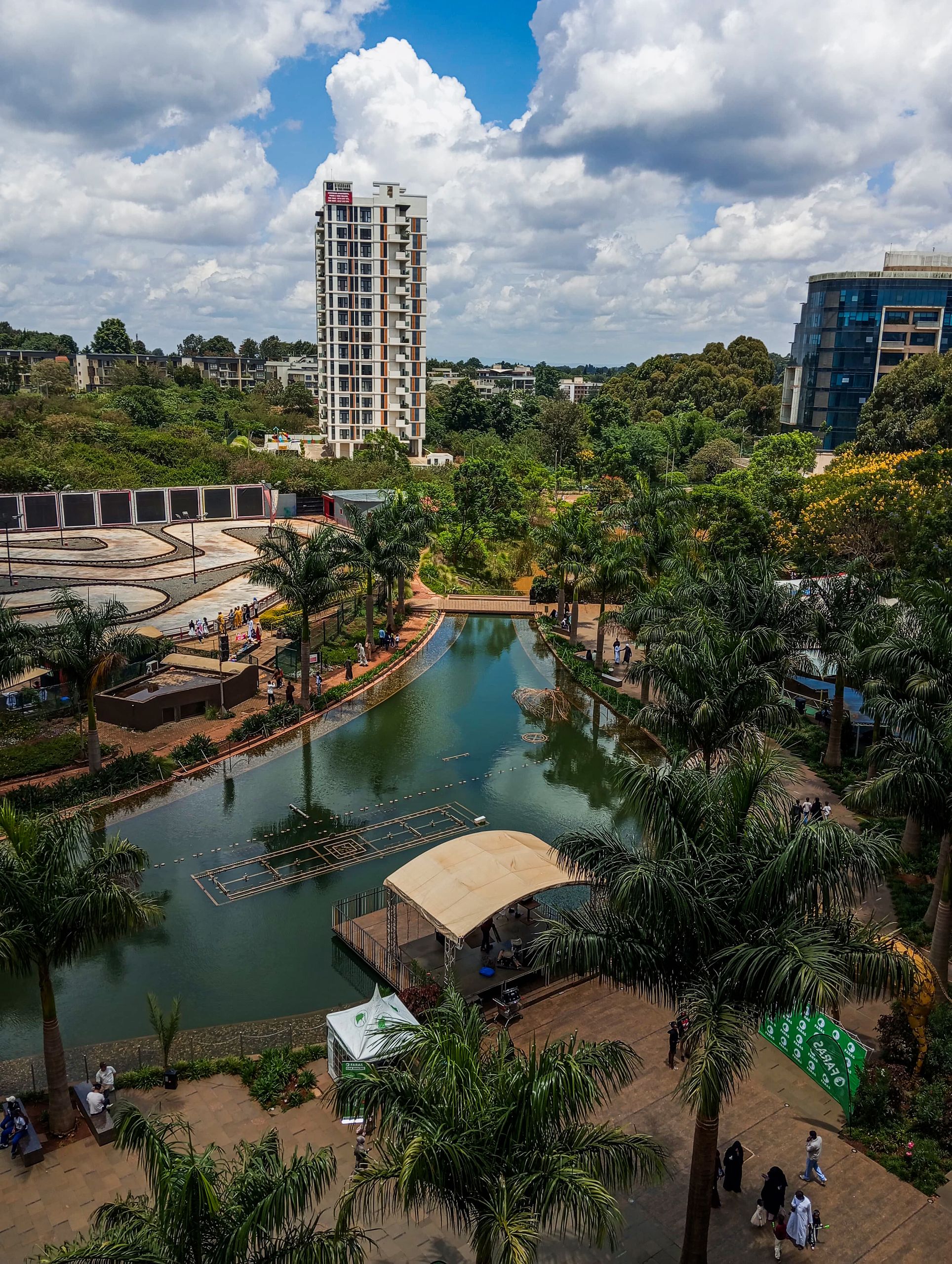 A stunning aerial view of Nairobi's urban park featuring a reflective lake and lush greenery.