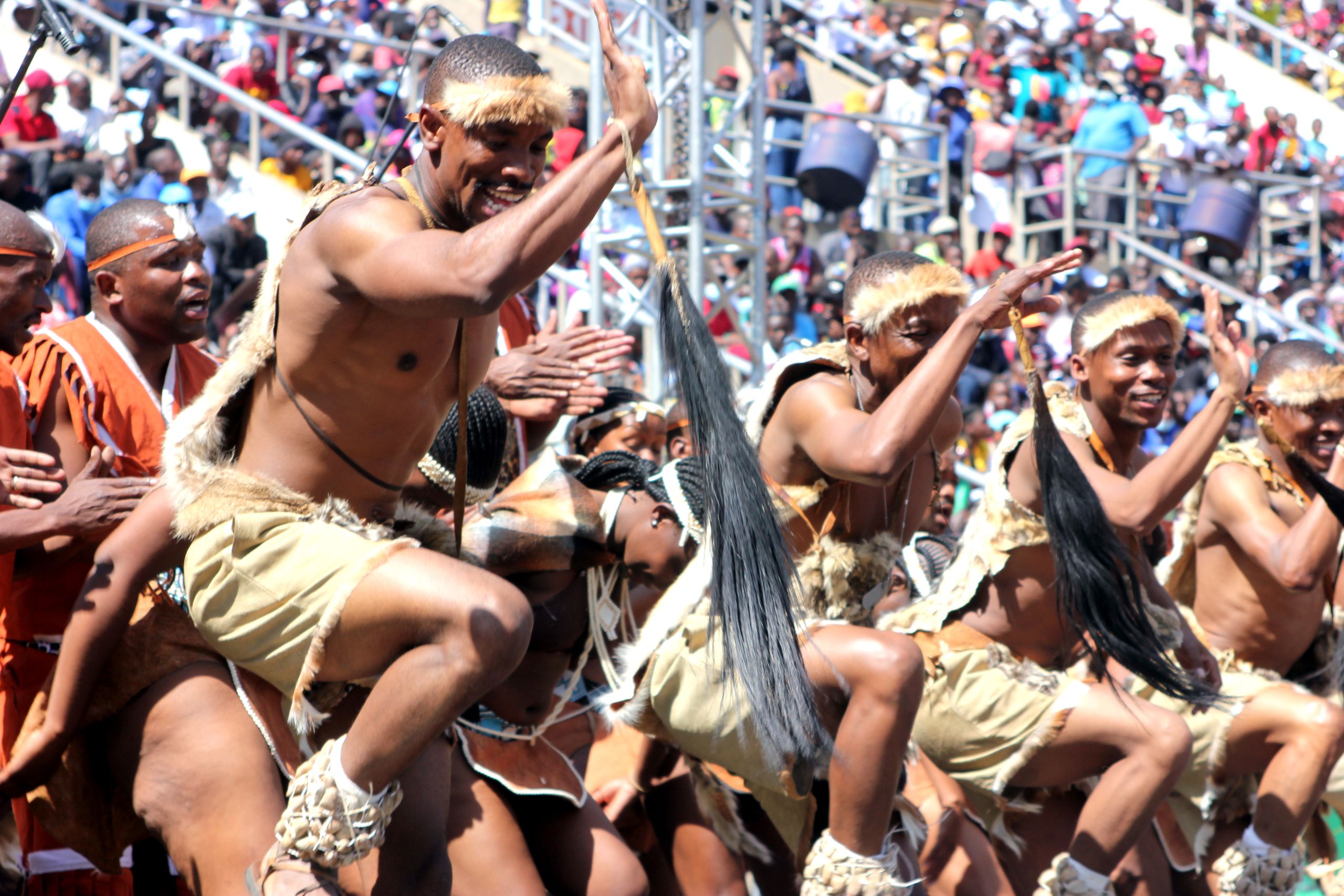 Energetic dance performance showcasing traditional attire and vibrant culture in Zimbabwe.